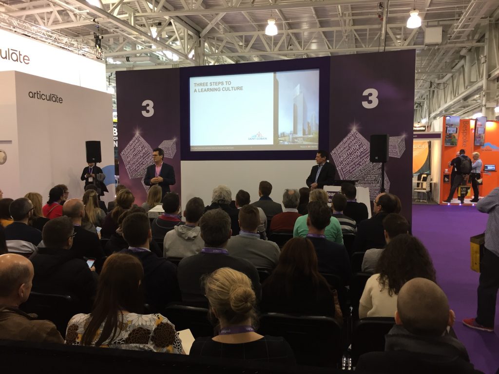 Adam Charlesworth from Teach on Mars (on the right, on the stage) at Learning Technologies London 2018